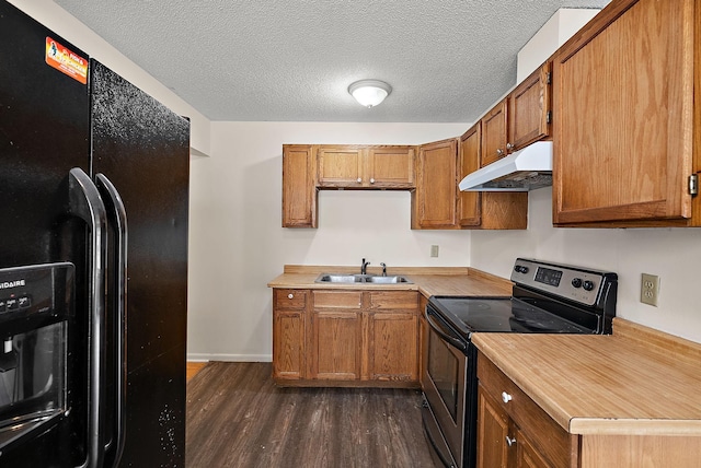 4625 Lyndale Ave N, Minneapolis, MN 55412 - kitchen with black refrigerator with ice dispenser, under cabinet range hood, stainless steel electric range, dark wood finished floors, and a sink