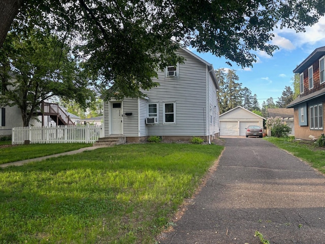 2428 14th Ave E, North Saint Paul, MN 55109 - view of front facade featuring a detached garage, an outbuilding, and cooling unit