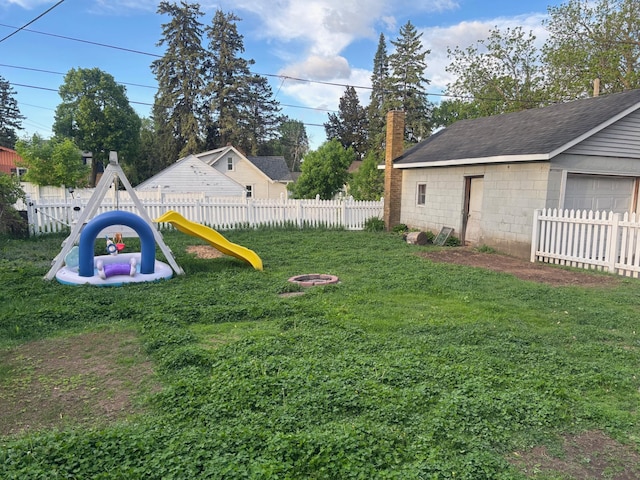 2428 14th Ave E, North Saint Paul, MN 55109 - view of yard featuring a playground and an outdoor structure