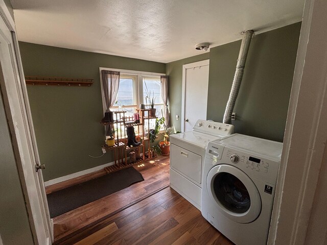 2428 14th Ave E, North Saint Paul, MN 55109 - washroom featuring washing machine and clothes dryer and dark wood finished floors