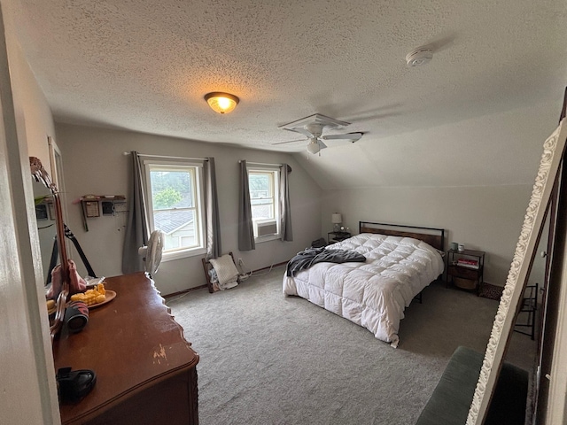 2428 14th Ave E, North Saint Paul, MN 55109 - bedroom featuring lofted ceiling, carpet floors, a textured ceiling, and baseboards