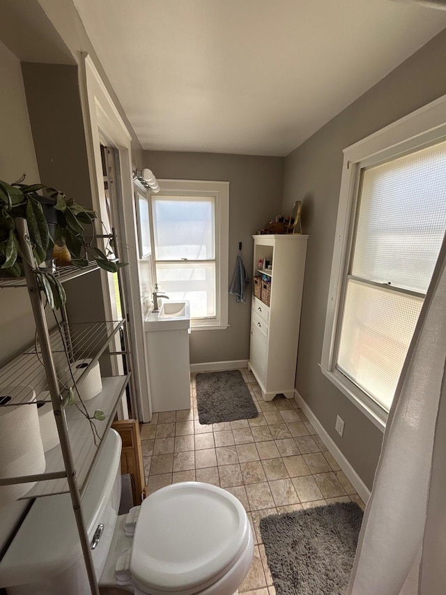 2428 14th Ave E, North Saint Paul, MN 55109 - bathroom with baseboards and vanity