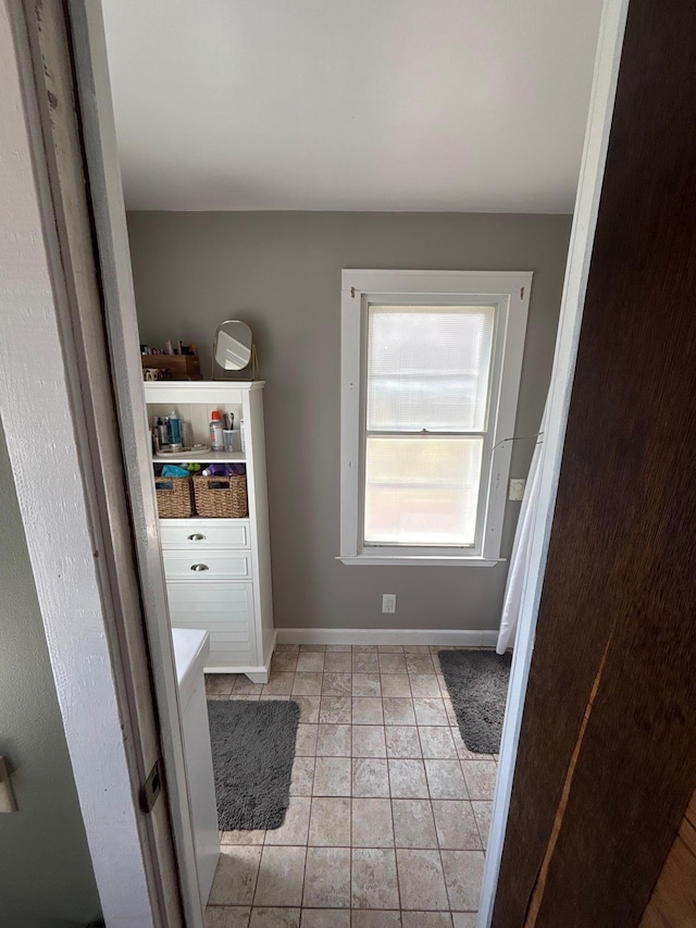 2428 14th Ave E, North Saint Paul, MN 55109 - bathroom with baseboards and tile patterned flooring