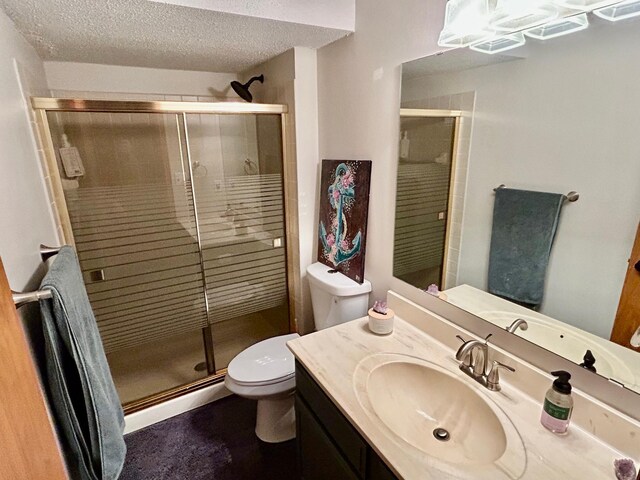 6640 Falstaff Rd, Woodbury, MN 55125 - full bathroom featuring a baseboard heating unit, toilet, a stall shower, a textured ceiling, and vanity