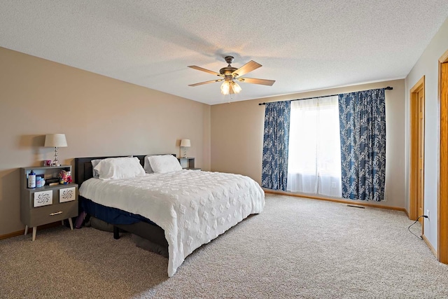 5901 106th Ave N, Brooklyn Park, MN 55443 - bedroom featuring carpet flooring, ceiling fan, and a textured ceiling