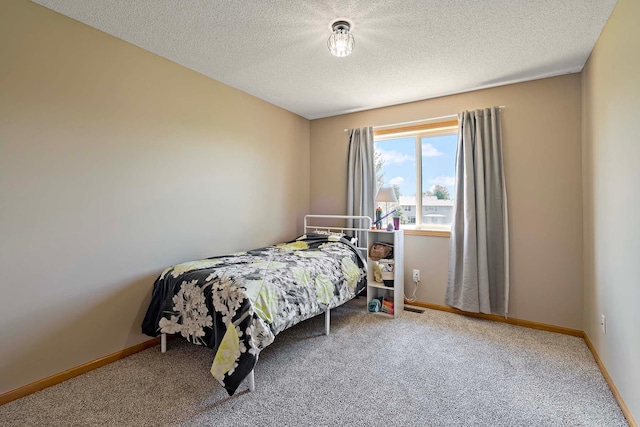 5901 106th Ave N, Brooklyn Park, MN 55443 - carpeted bedroom featuring a textured ceiling and baseboards