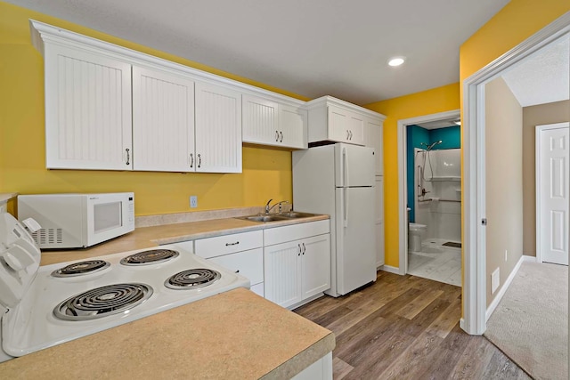 5901 106th Ave N, Brooklyn Park, MN 55443 - kitchen with white appliances, light wood finished floors, light countertops, white cabinetry, and recessed lighting