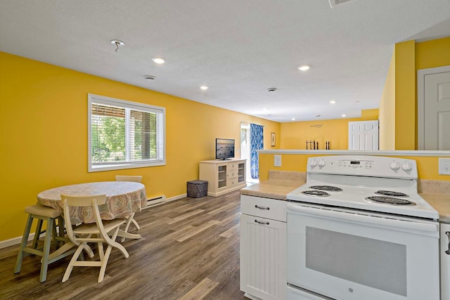 5901 106th Ave N, Brooklyn Park, MN 55443 - kitchen with white electric range oven, wood finished floors, light countertops, white cabinetry, and a baseboard heating unit