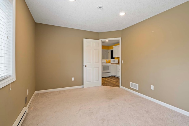 5901 106th Ave N, Brooklyn Park, MN 55443 - unfurnished bedroom featuring a baseboard radiator, carpet floors, a textured ceiling, and recessed lighting