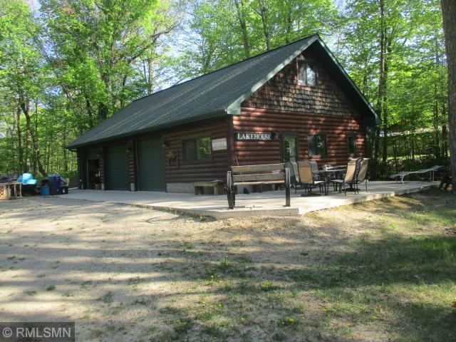 surrounding community with a garage and a patio