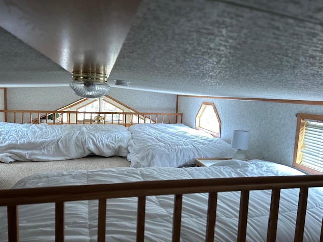bedroom featuring a textured wall