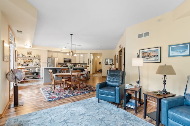 2565 Franklin Ave Unit 211, Saint Paul, MN 55114 - living area featuring light wood-style floors