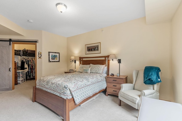 2565 Franklin Ave Unit 211, Saint Paul, MN 55114 - carpeted bedroom with a barn door, a closet, and a spacious closet