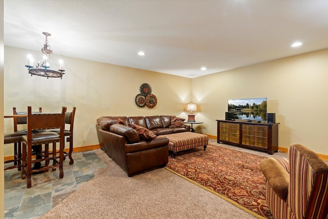 living room with recessed lighting, a chandelier, baseboards, and stone finish flooring