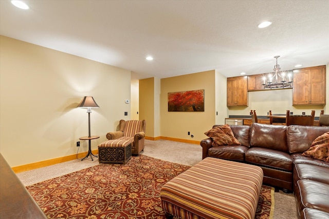 carpeted living room with recessed lighting, a chandelier, and baseboards