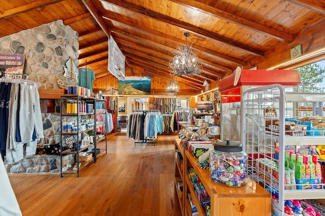 game room with hardwood / wood-style floors, wooden ceiling, and a chandelier