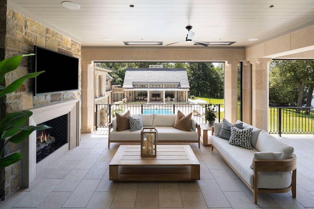 2770 Gale Rd, Woodland, MN 55391 - view of patio / terrace with an outdoor living space with a fireplace and ceiling fan