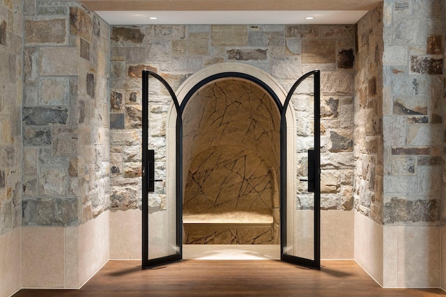 2770 Gale Rd, Woodland, MN 55391 - wine room with wood finished floors and arched walkways