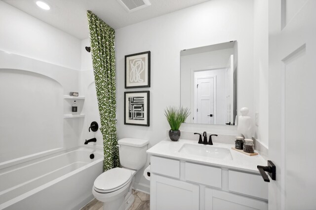 7869 41st St N, Oakdale, MN 55128 - full bathroom featuring toilet, vanity,  shower combination, and baseboards
