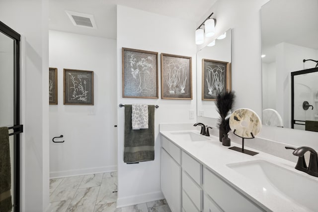 7869 41st St N, Oakdale, MN 55128 - full bath featuring marble finish flooring, a shower with door, double vanity, and baseboards