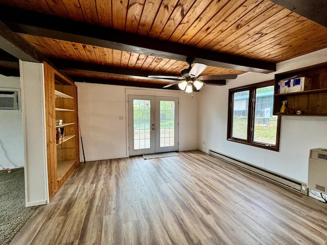 56279 350th St, Warroad, MN 56763 - unfurnished living room featuring wooden ceiling, wood finished floors, beam ceiling, baseboard heating, and french doors