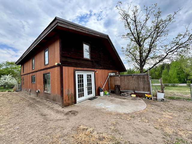 56279 350th St, Warroad, MN 56763 - back of property with french doors and fence