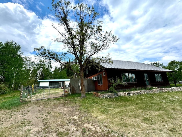 56279 350th St, Warroad, MN 56763 - view of front of house featuring driveway and metal roof