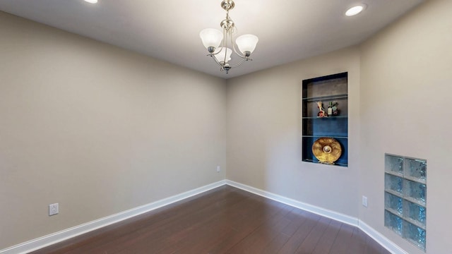 610 Main St, Adams, MN 55909 - unfurnished room featuring dark wood-style flooring, baseboards, recessed lighting, a chandelier, and built in features