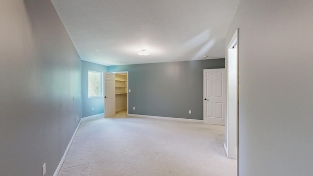 610 Main St, Adams, MN 55909 - empty room with baseboards and light carpet
