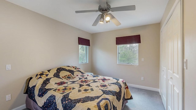 610 Main St, Adams, MN 55909 - bedroom featuring carpet floors, baseboards, a closet, and a ceiling fan