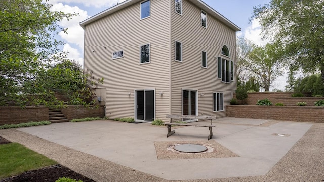 610 Main St, Adams, MN 55909 - back of property featuring a patio area and fence