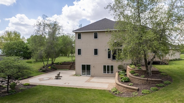 610 Main St, Adams, MN 55909 - back of house with stairway, a yard, a patio area, and a shingled roof