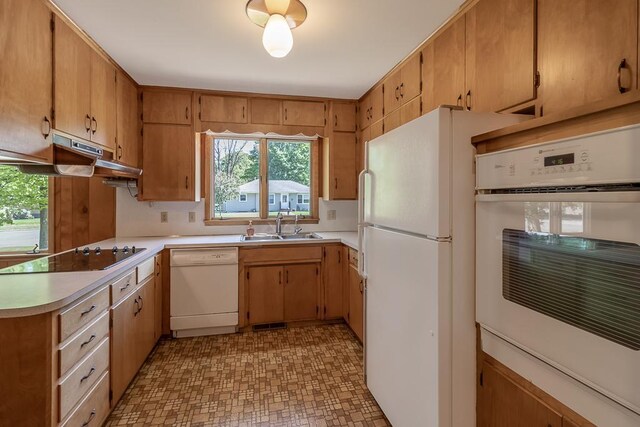468 Washington St, Le Center, MN 56057 - kitchen featuring white appliances, a sink, light countertops, and under cabinet range hood