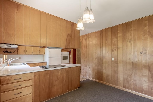 468 Washington St, Le Center, MN 56057 - kitchen with white appliances, a sink, wooden walls, light countertops, and a peninsula