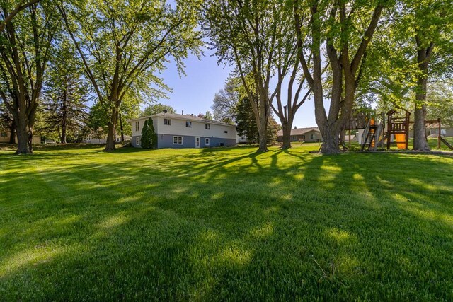 468 Washington St, Le Center, MN 56057 - view of green lawn with a playground