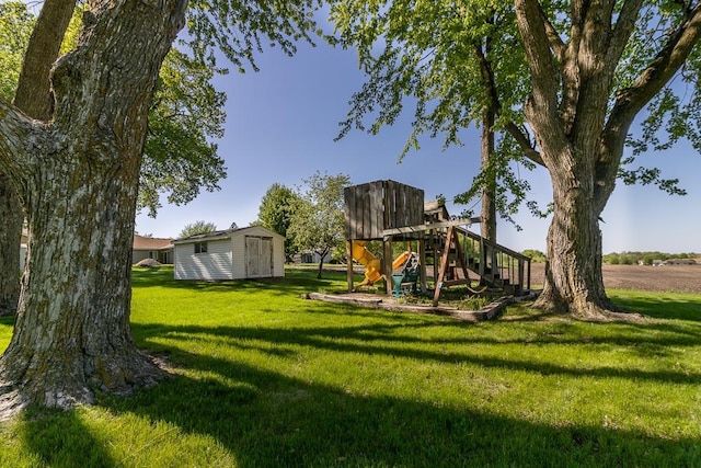 468 Washington St, Le Center, MN 56057 - view of jungle gym with a lawn, an outbuilding, and a shed