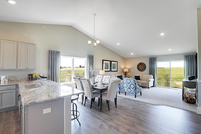 8852 Jorgensen Ave S, Cottage Grove, MN 55016 - dining room with recessed lighting, dark wood finished floors, high vaulted ceiling, and a chandelier