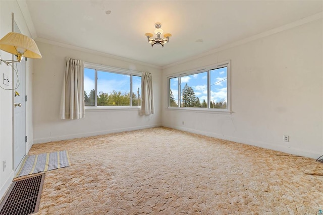 2505 Piedmont Ave, Duluth, MN 55811 - carpeted empty room featuring crown molding, baseboards, and a chandelier