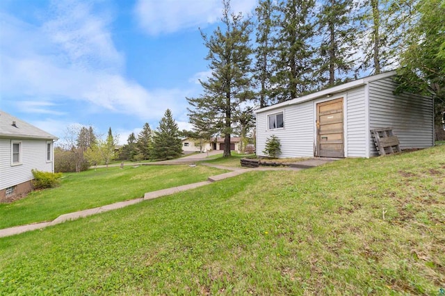 2505 Piedmont Ave, Duluth, MN 55811 - view of grassy yard with an outdoor structure