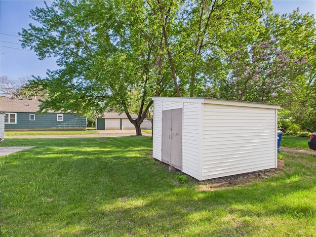 3502 3rd St N, Saint Cloud, MN 56303 - view of green lawn featuring an outdoor structure and a storage shed