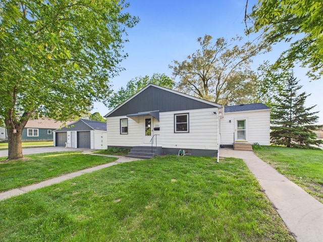 3502 3rd St N, Saint Cloud, MN 56303 - bungalow-style house with an outbuilding, a detached garage, and a front lawn