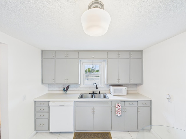 3502 3rd St N, Saint Cloud, MN 56303 - kitchen with white appliances, a sink, gray cabinetry, light countertops, and a textured ceiling