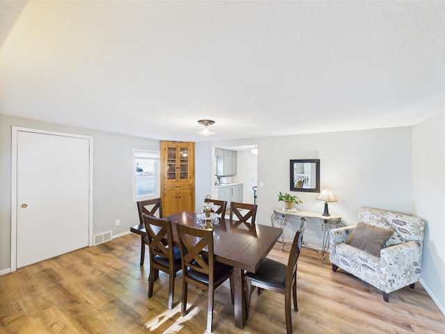 3502 3rd St N, Saint Cloud, MN 56303 - dining area with light wood-type flooring and baseboards