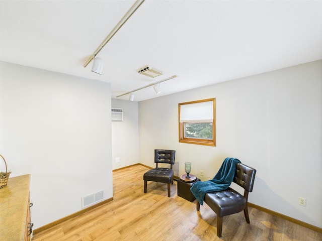 3502 3rd St N, Saint Cloud, MN 56303 - sitting room featuring light wood-type flooring, track lighting, and baseboards