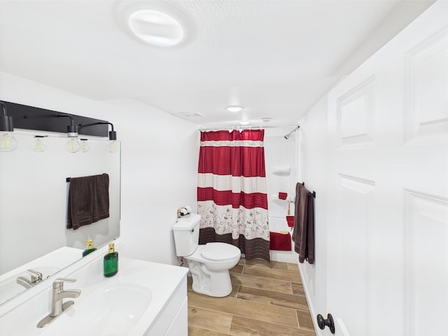 3502 3rd St N, Saint Cloud, MN 56303 - full bathroom featuring wood finished floors, toilet, vanity, and a shower with shower curtain