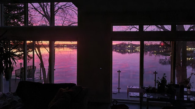 doorway to outside with a water view