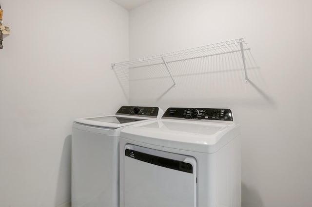 laundry room with washer and clothes dryer