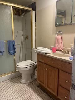 full bathroom with a shower stall, toilet, and vanity