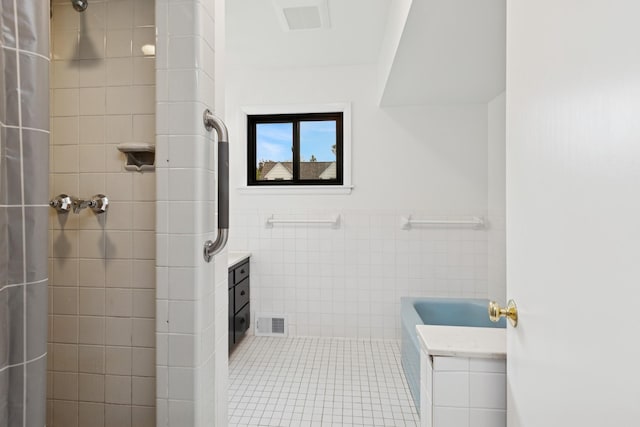 124 Paisley Ln, Golden Valley, MN 55422 - full bathroom with tile walls, a shower with shower curtain, a bathtub, a wainscoted wall, and tile patterned flooring