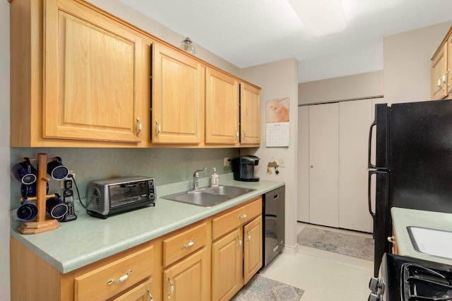 4201 Lakeside Ave N Unit 317, Brooklyn Center, MN 55429 - kitchen featuring a sink, black dishwasher, light countertops, light brown cabinetry, and gas range